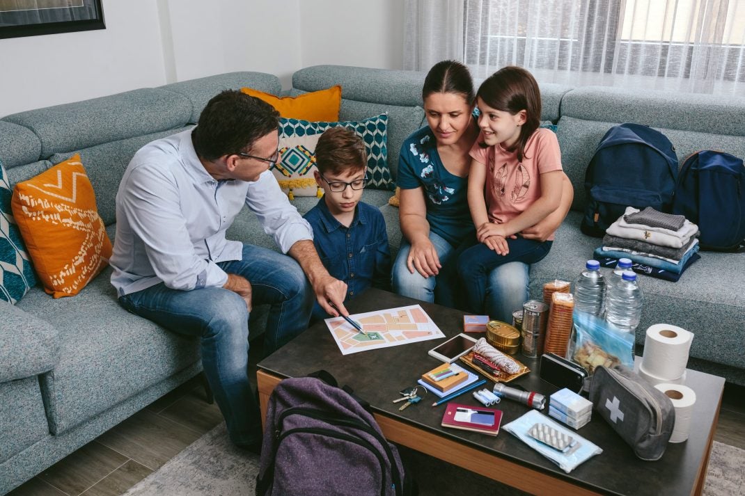 Family making emergency preparedness plans.